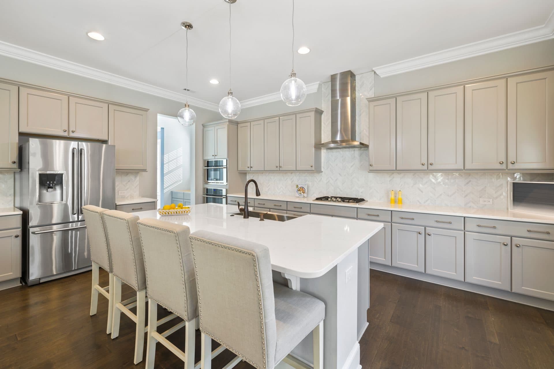A bright kitchen with crisp white cabinets and a clean, even finish